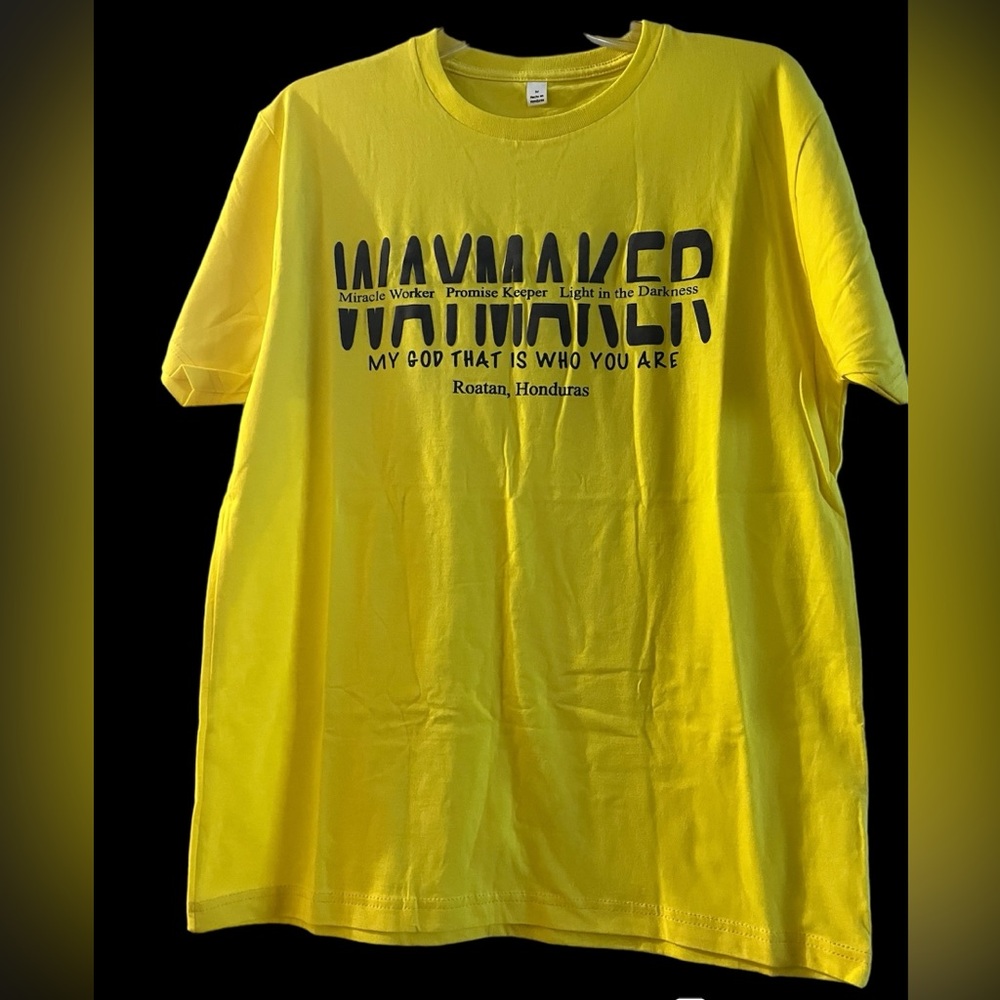 Yellow graphic tee.
